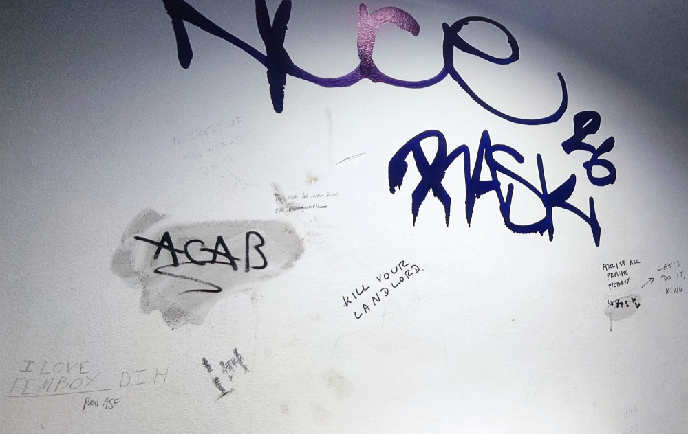 Derogatory graffiti is being allowed to build up across every surface in Crewe Bus Station's men's toilets (Photo: Nub News).