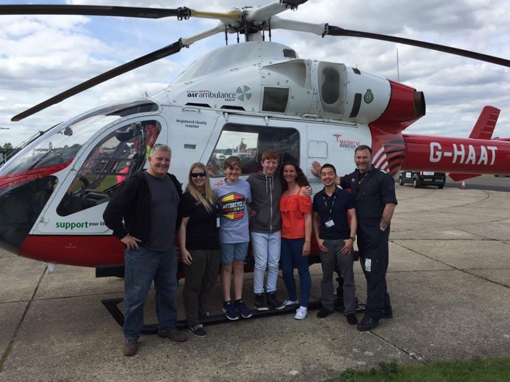 Karen Drew with Jacob and family members on a visit to see the air ambulance. 