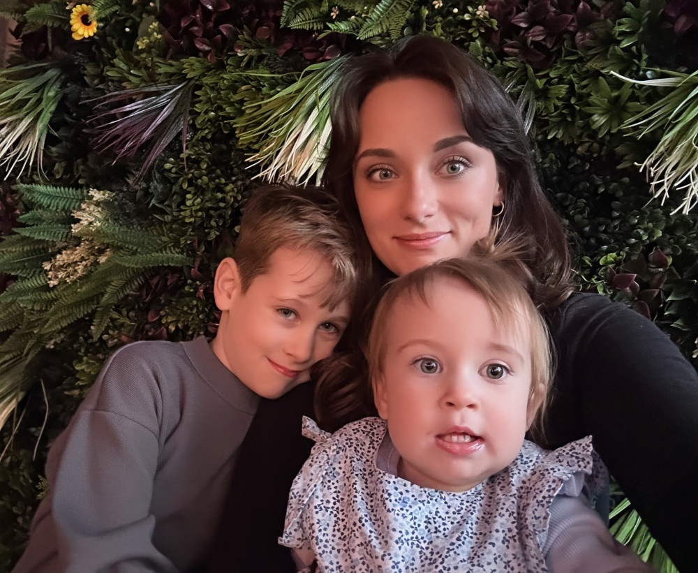 Charlotte with her children, whose experiences as a mother have helped shape her passion for supporting early childhood development and family wellbeing.