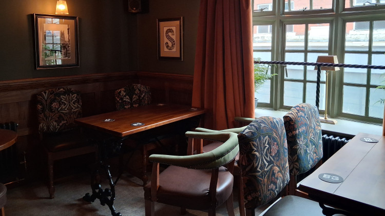 The Swan with Two Necks, a traditional pub in Stockport town centre, has unveiled a cosy new upstairs room (Image - Ian Burke)