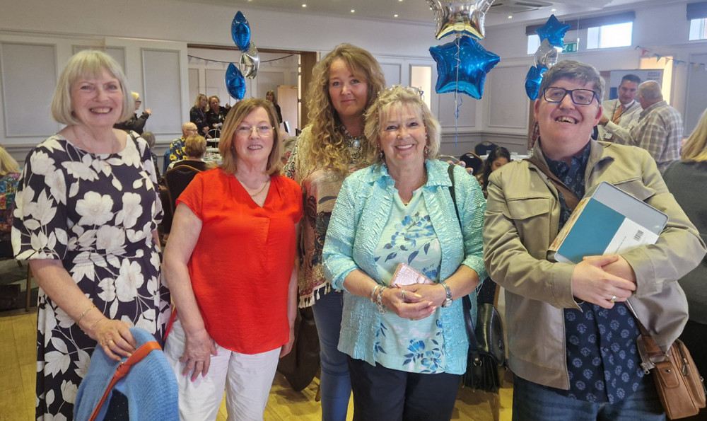 Joan (in red) with colleagues from the Hadleigh Charity Shop