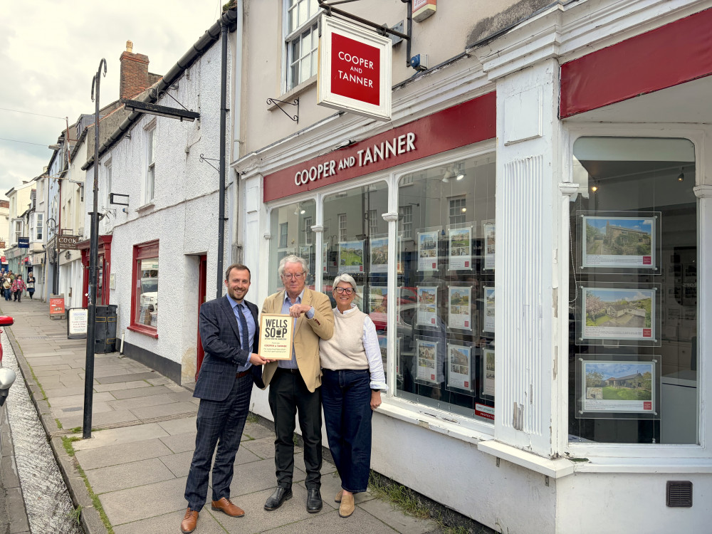 Philip Welch from SOUP presents a certificate of appreciation for their support to Sam Masters, Branch Manager of Cooper & Tanner and their Office Manager Lorraine Cane