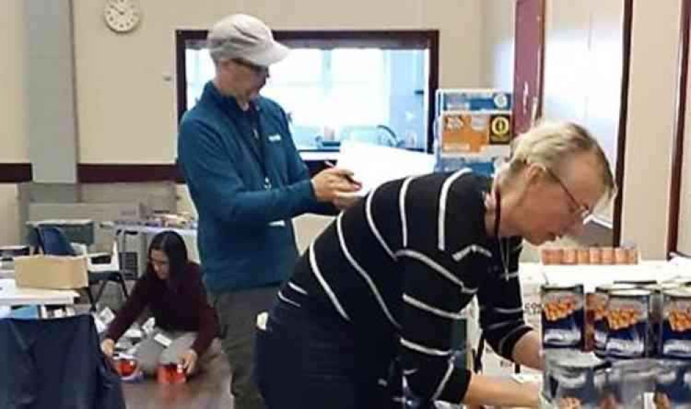 Feed The Need volunteers preparing food and supplies