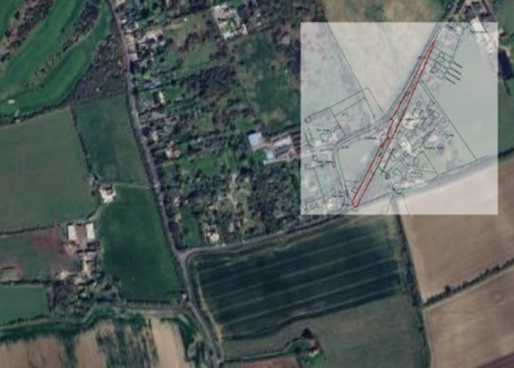 The narrow path of land that is for sale. 