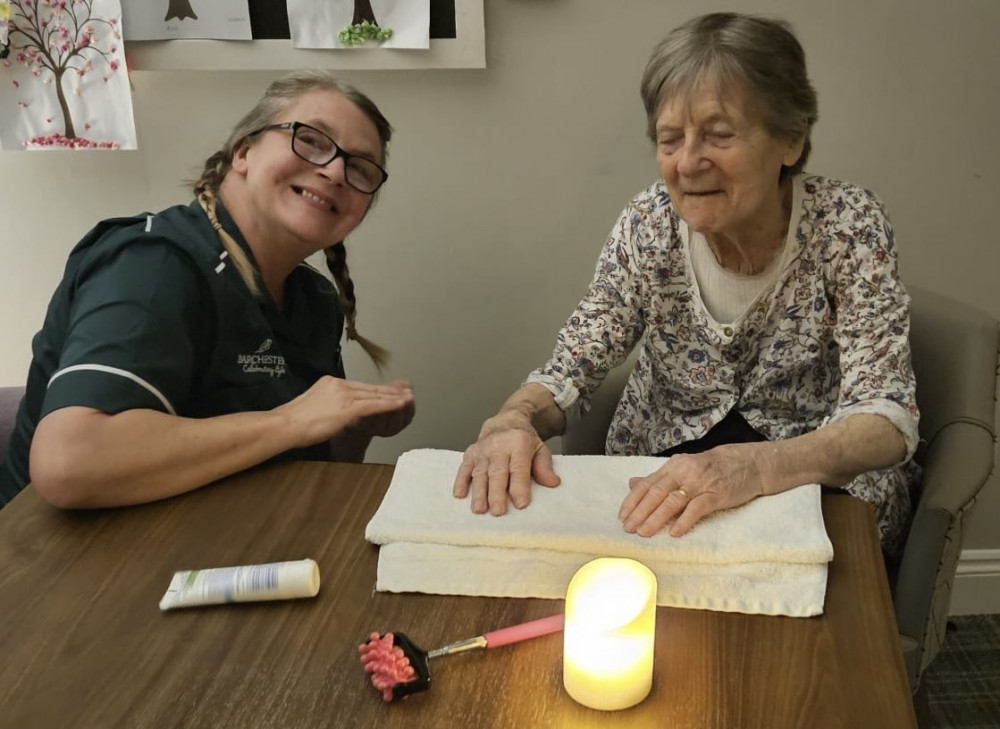 Resident Gillian with a member of the dedicated care team at Crandon Springs who created the relaxing spa experience.