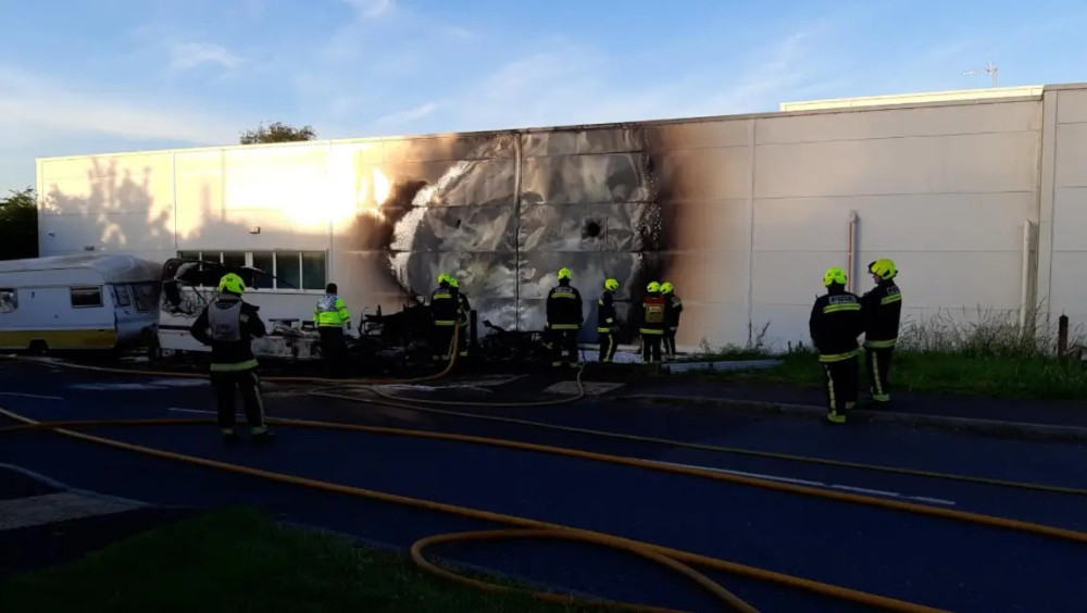 Investigation launched after intentional fire damages two caravans in Glastonbury on 13 June.