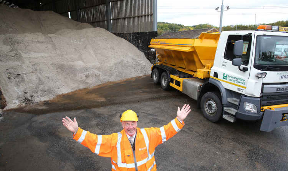 Cllr Trevor Pendleton with a county council gritter and salt stock pile - Coalville roads are being treated in the icy weather