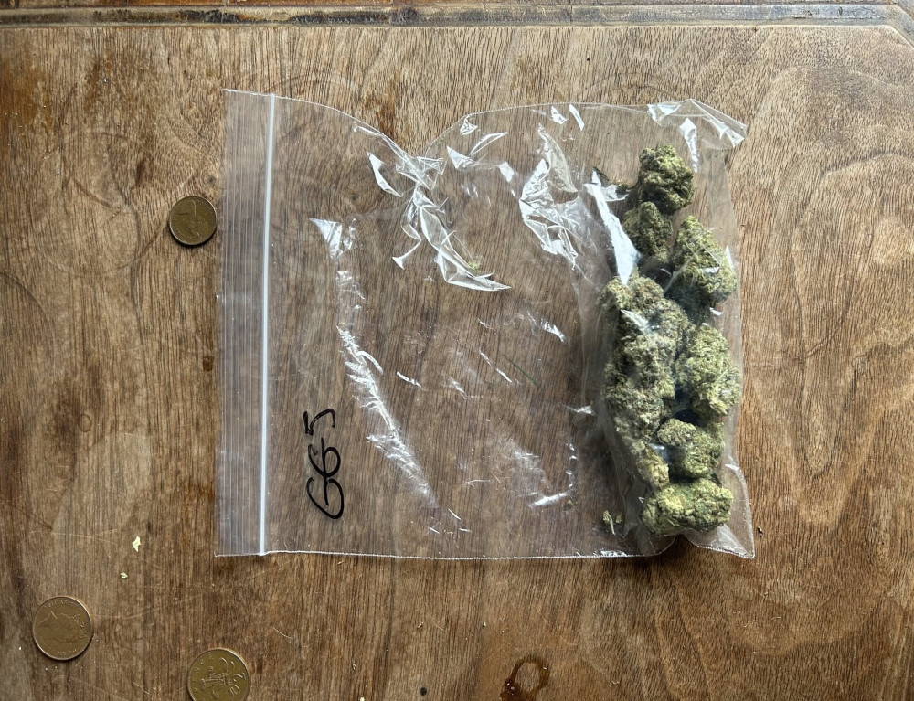 Driver arrested in Leamington for drug offenses; investigation uncovers drugs, cash, and weapons. (image via Leamington Police)