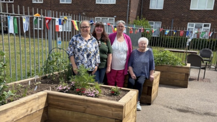 Residents in Soouth Ockendon by the new community garden. 