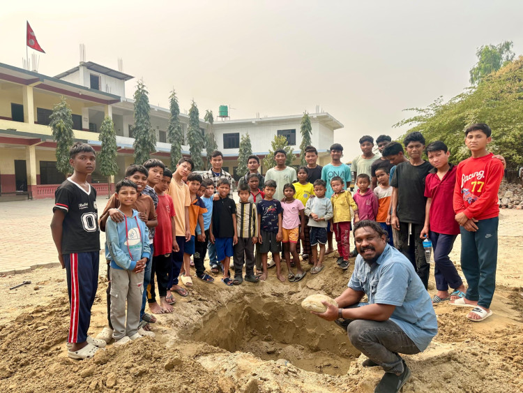 Pastor Ruben Rasaili with the children at The Innovative Academy in Nepal (image supplied) 