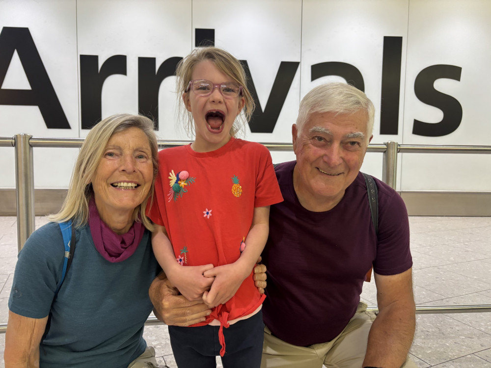 Robert and Ana Marie Gomez reunited with their granddaughter Mabel at Heathrow Airport earlier this month (Image supplied)