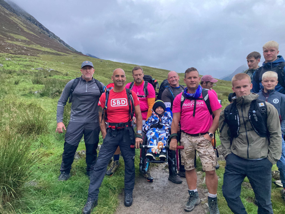 Pete Haslam, aided by 15 supporters, will undertake a 23-mile Three Peaks challenge, carrying his paraplegic son, Ted, to raise funds for Molly Ollys  (image supplied) 