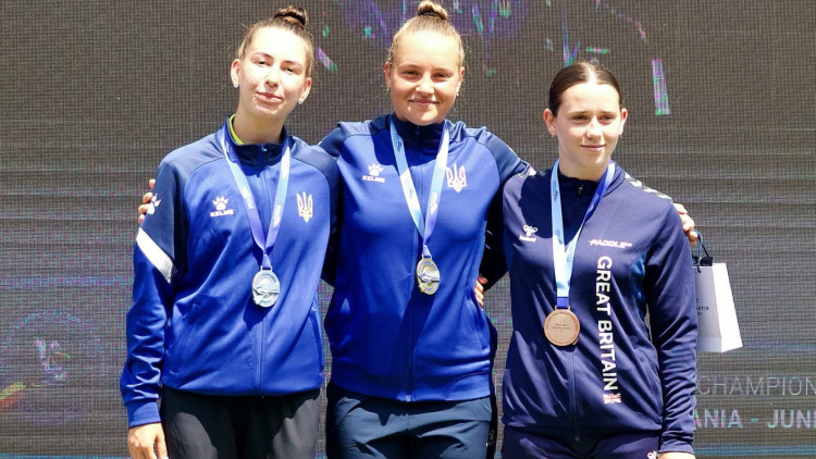 16-year-old Isabella Keane (right) with her bronze medal at 2026 Canoe Marathon European Championships (credit: PaddleUK).