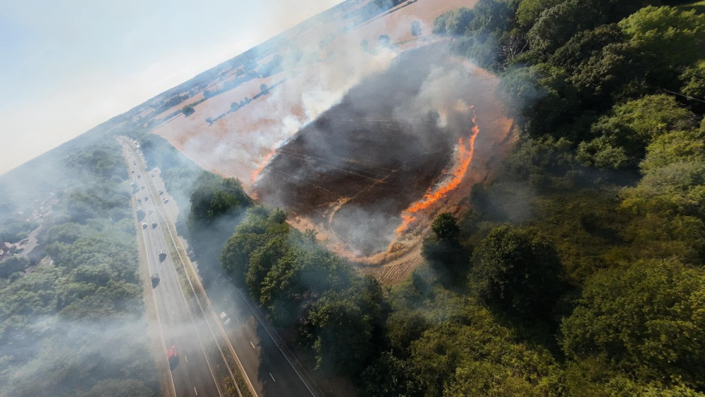 The field was well alight when firefighters arrived (image by Alex Harvey)