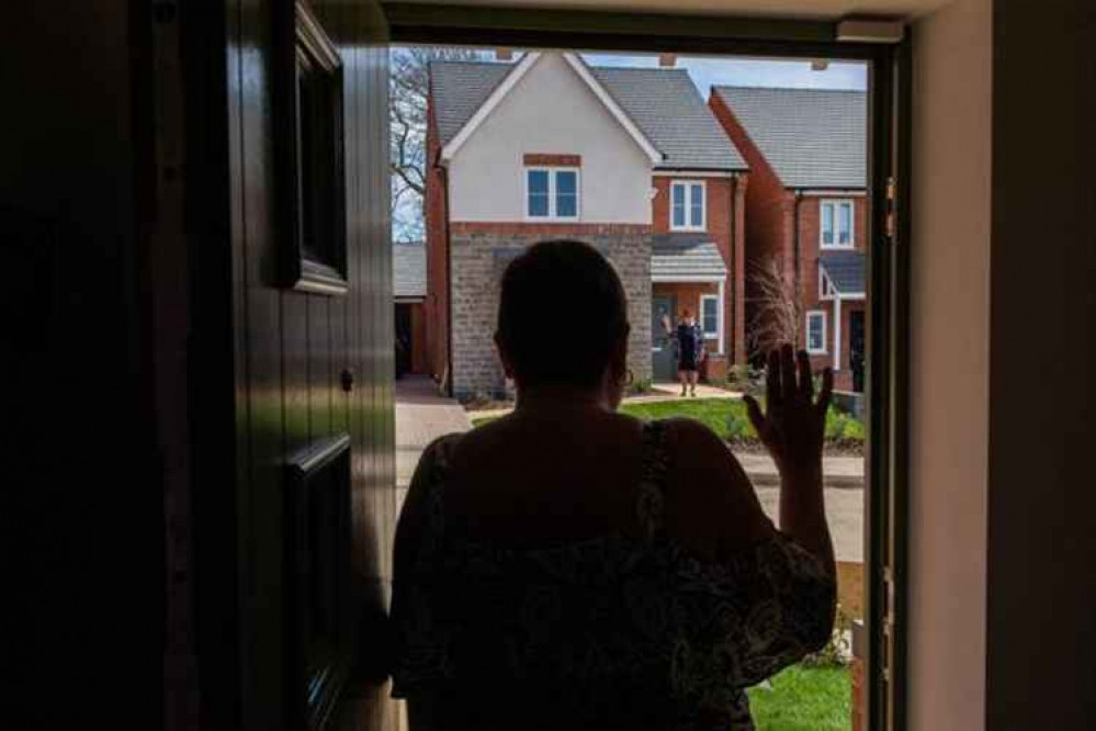 Mum and daughter can wave at each other from their front doors