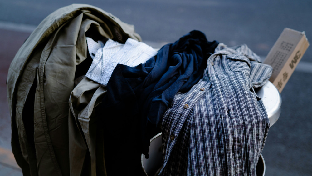 Stock image of unwanted clothes (credit: Lance Chang on Unsplash).