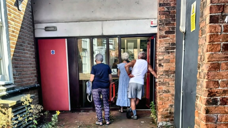 Local residents queuing at the Royal Mail Nantwich postal depot to collect urgent mail (Photo: Nub News).