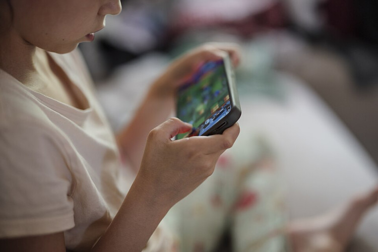 Cheshire East Council is urging parents to think carefully before giving their child a smartphone, waiting until at least the age of 14 (Photo: Wiki Commons).