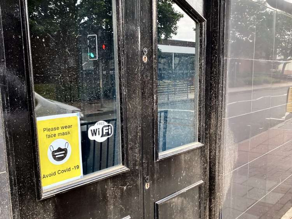 Cllr Wyatt's photos show mud and dirt left on shop fronts after the clean up