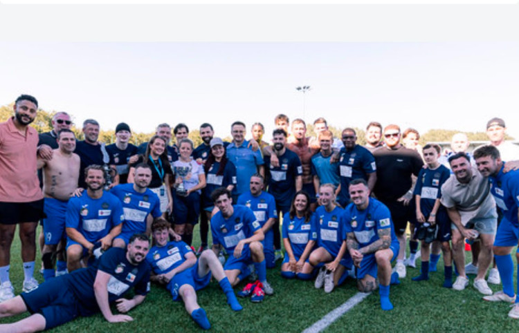 Henry's family and friends pictures with the Sellebrity team.
