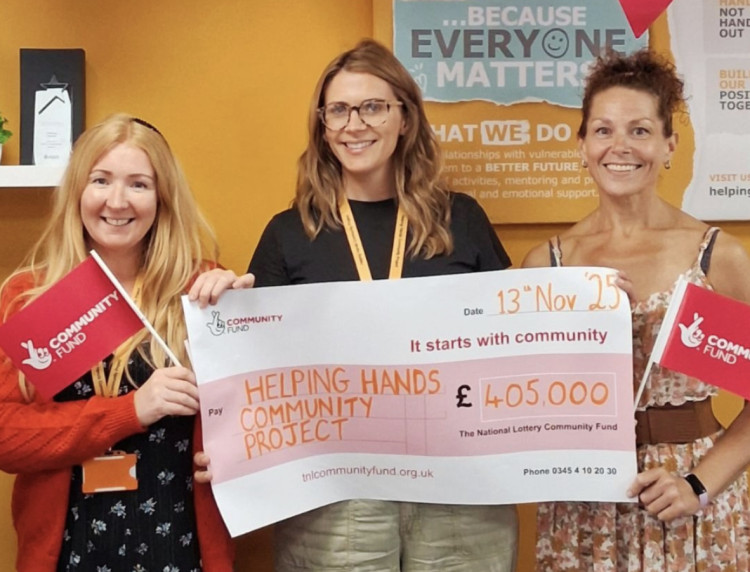 Helping Hands with National Lottery cheque (image supplied) 