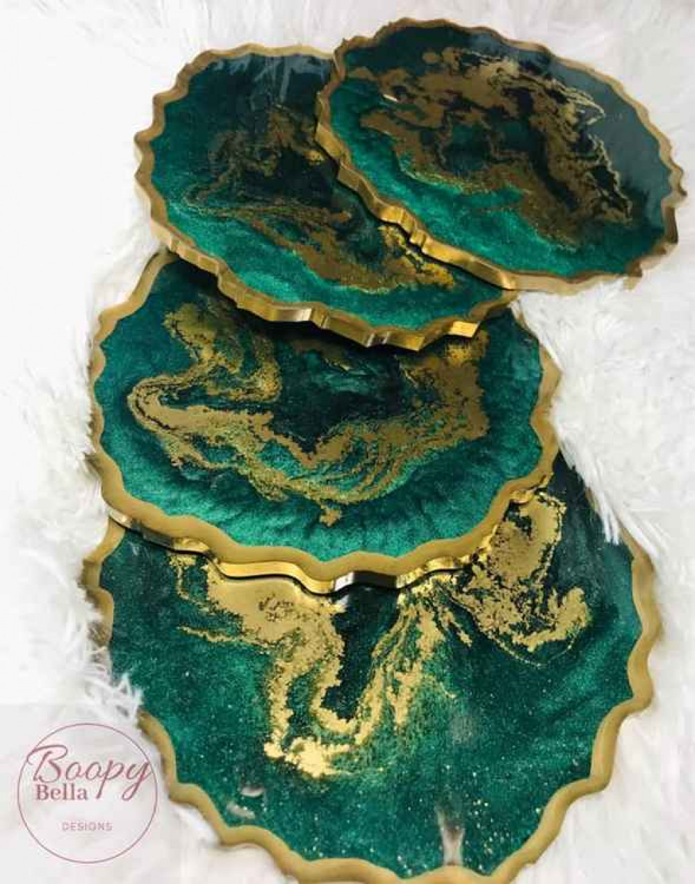 Beautiful set of coasters in emerald green with gold accents.