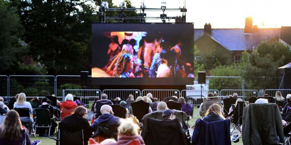 Residents and visitors enjoying the 'Cinema in the Park' event at Coalville Park