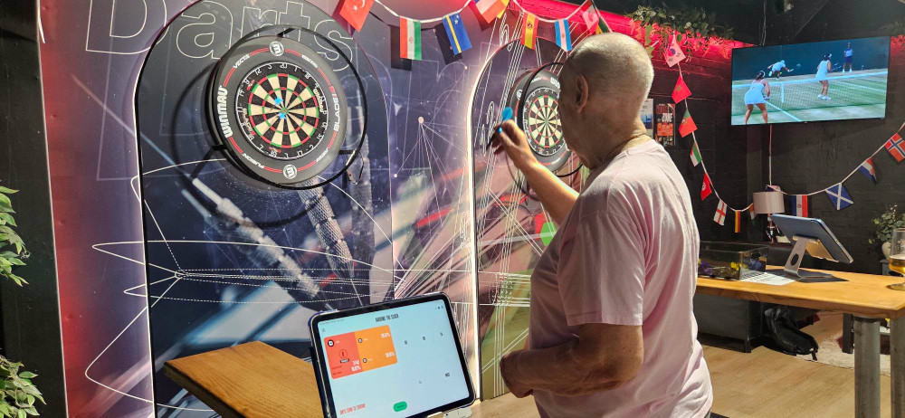 Staff at Elworth Grange Care Home found out resident Jim Long used to run a darts team so they took him along to a local sports venue so he could play a game or two! (Photo: Elworth Grange Care Home) 