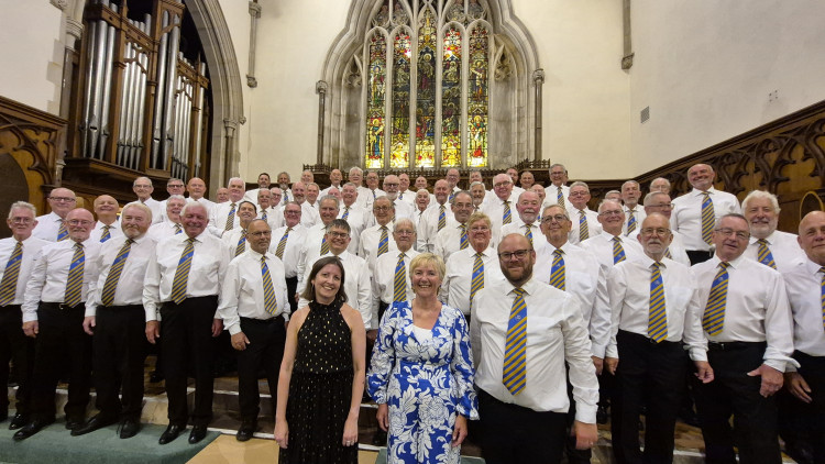 Choir members at the end of a successful concert 