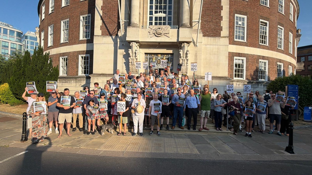 Residents gathered outside the Guildhall on Thursday to protest against Kingston University's plans for a new building at Middle Mill (Credit: Chris Park)