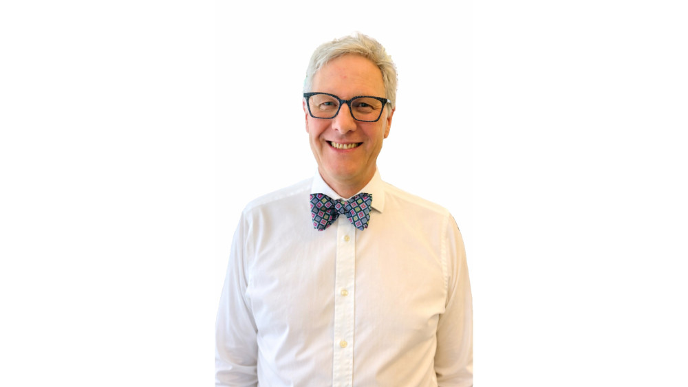 Christopher Young, nearly 40 years in optics, values technology but prioritizes time, trust, and personal care. His Shepton Mallet practice emphasizes personalized care, adapting to modern challenges like screen-induced myopia.