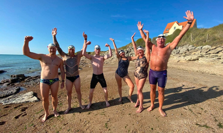 Alexander Sixsmith and his team celebrate completing the cross-Channel swim (Credit: Supplied)
