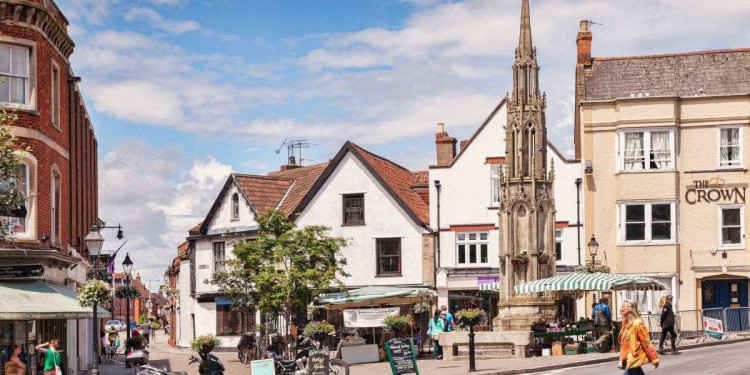 Glastonbury Town Council says scaffolding will remain around the historic Market Cross while repair plans are agreed for the Grade II listed structure. (Photo: GTC)