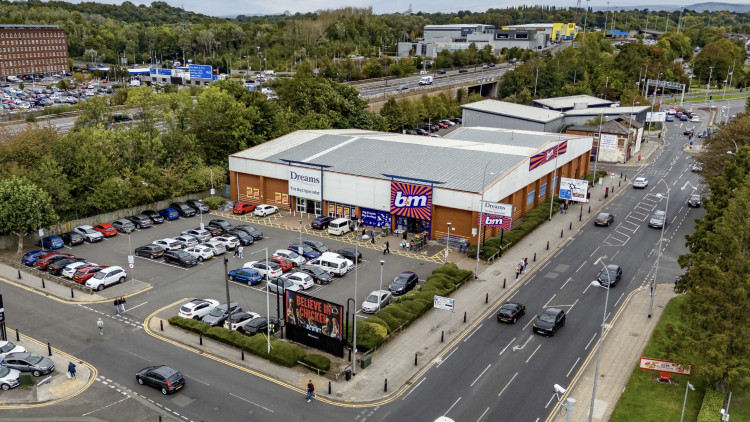 The Tatton Estate has acquired the retail warehouses on Great Portwood Street, which is occupied by the Dreams and B&M stores (Image - Tatton Estate)