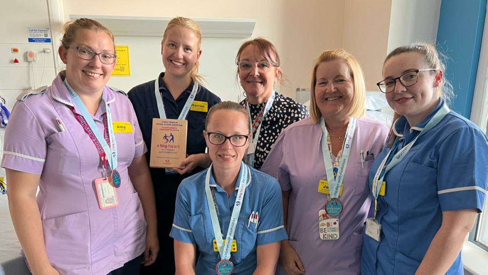 Staff from Children's HDU with their award (image via UHNM)