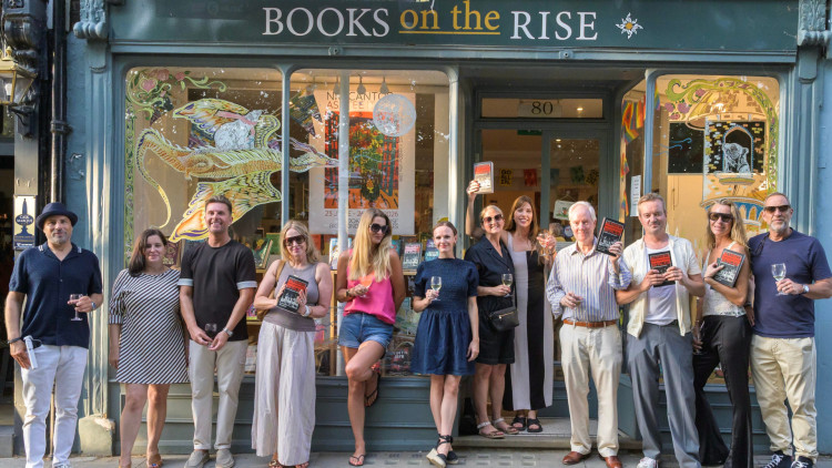 Richmond Literary Press and members of the community celebrating its first title release at Books on the Rise (credit: Image supplied).