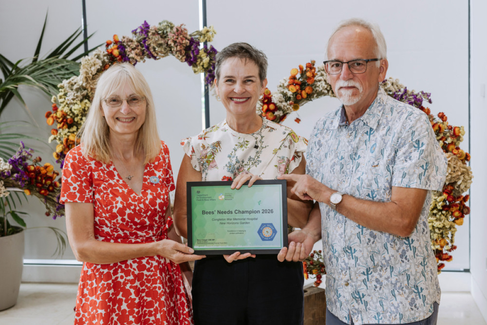 Patti Pinto and John Sherwood receiving the award from MP Mary Creagh (centre) (Credit: ECNHST)