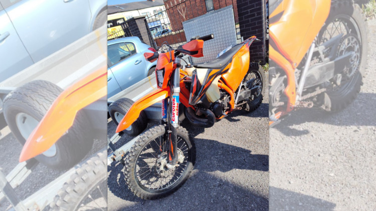 Police seized this orange off-road bike on Saturday 11 July - it was being driven anti-socially around Reddish and Lancashire Hill (Image - GMP)