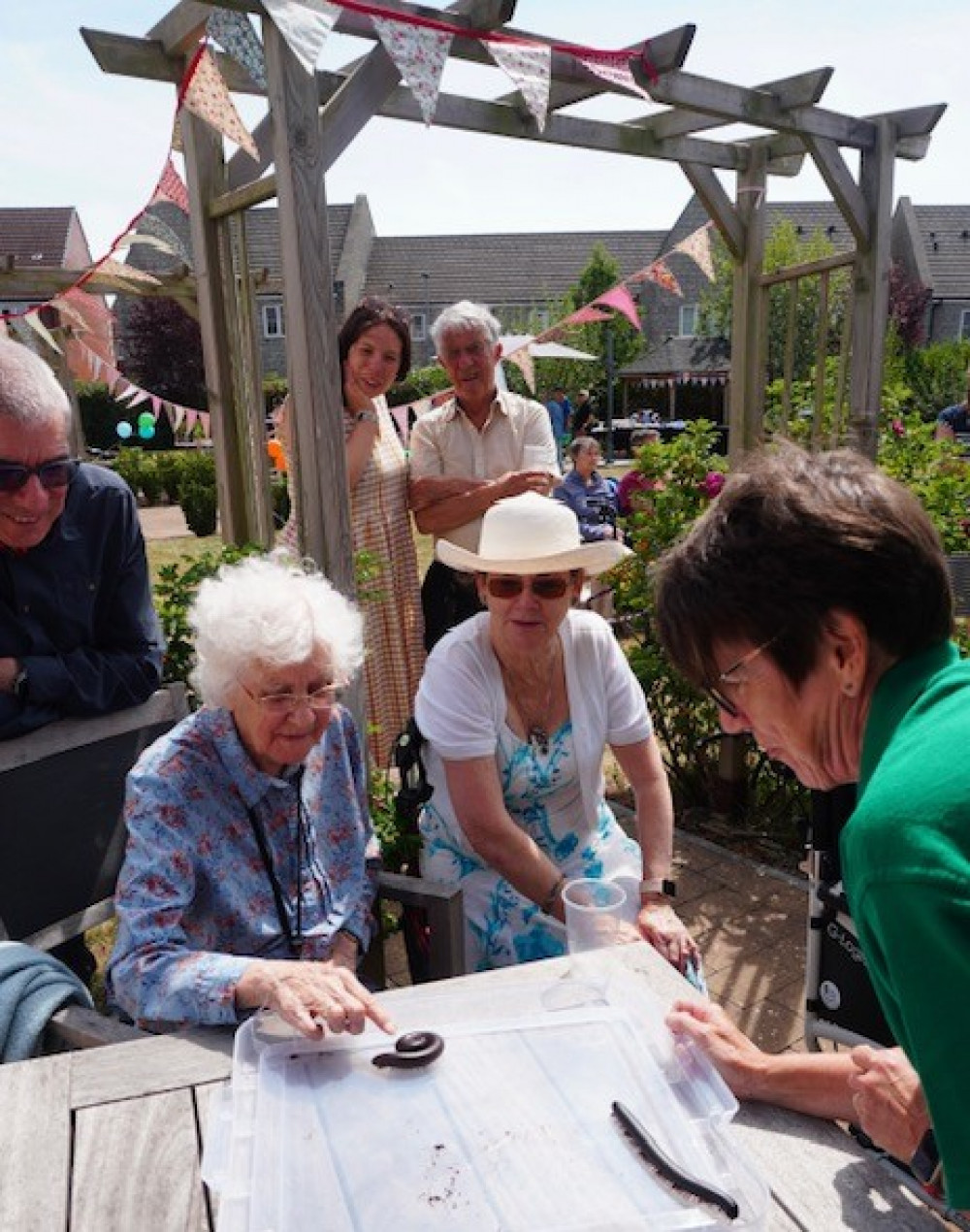 Crandon Springs resident Joy enjoying her encounter with giant centipedes at the home's Summer Party & BBQ.