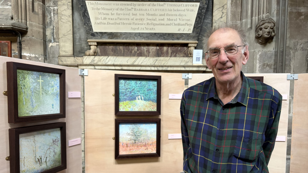 R N Clarke beside his exhibition at St Mary's Church (image via Livia Gregor)