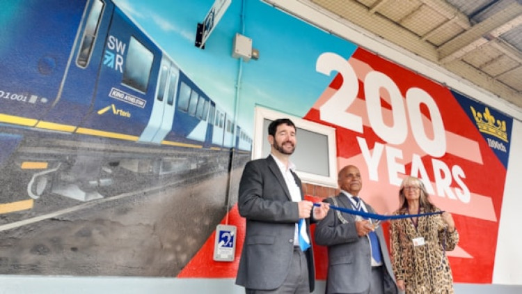 Kingston Council's leader Cllr Andreas Kirsch (L) and the Mayor of Kingston Cllr Thay Thaylan (middle) attended the mural unveiling (CRedit: SWR)