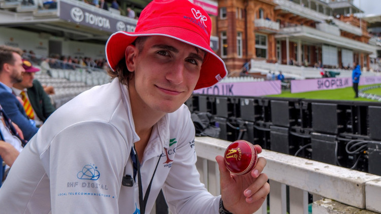 Sam Bodoano had to run while holding a cricket ball and dressed in full cricket whites (credit: SWNS).