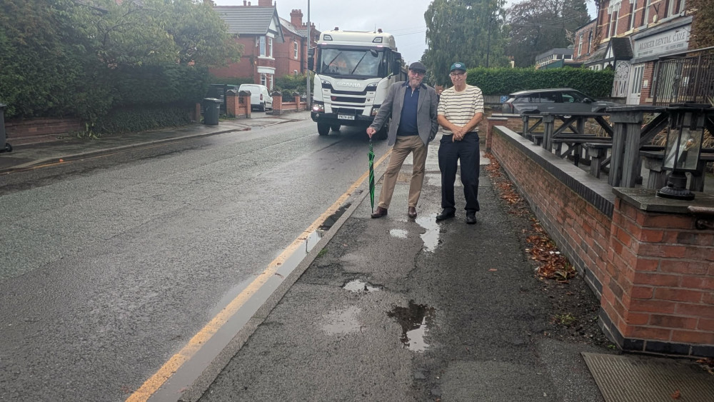 Cllr Kain and Cllr Fletcher standing on one side of the Crewe Road pavement which will be resurfaced. (Photo: Nub News)