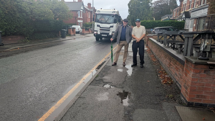 Cllr Kain and Cllr Fletcher standing on one side of the Crewe Road pavement which will be resurfaced. (Photo: Nub News)