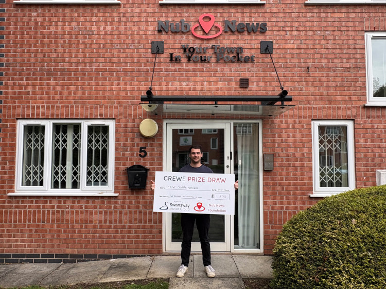 Louis Hancock with his £1,500 Crewe Prize Draw cheque at the Nub News head office (Credit: Nub News)
