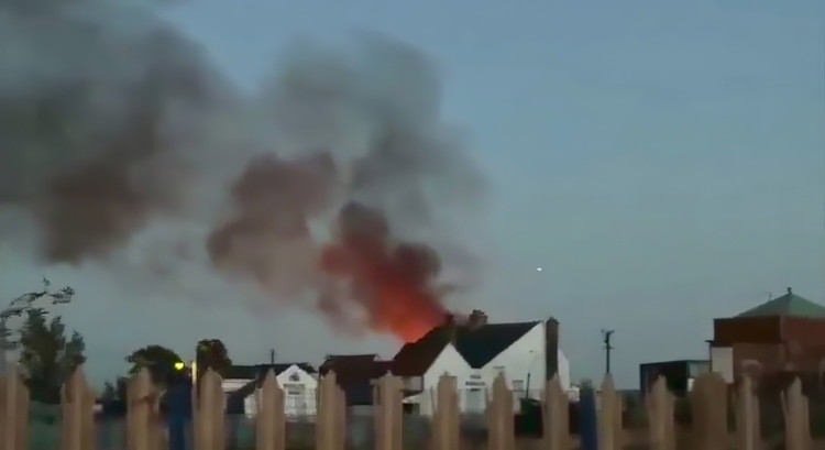 This dramatic picture taken soon after the alarm was raised shows flames behind the pub. They were contained to an area behind the historic building, which wasn't damaged.