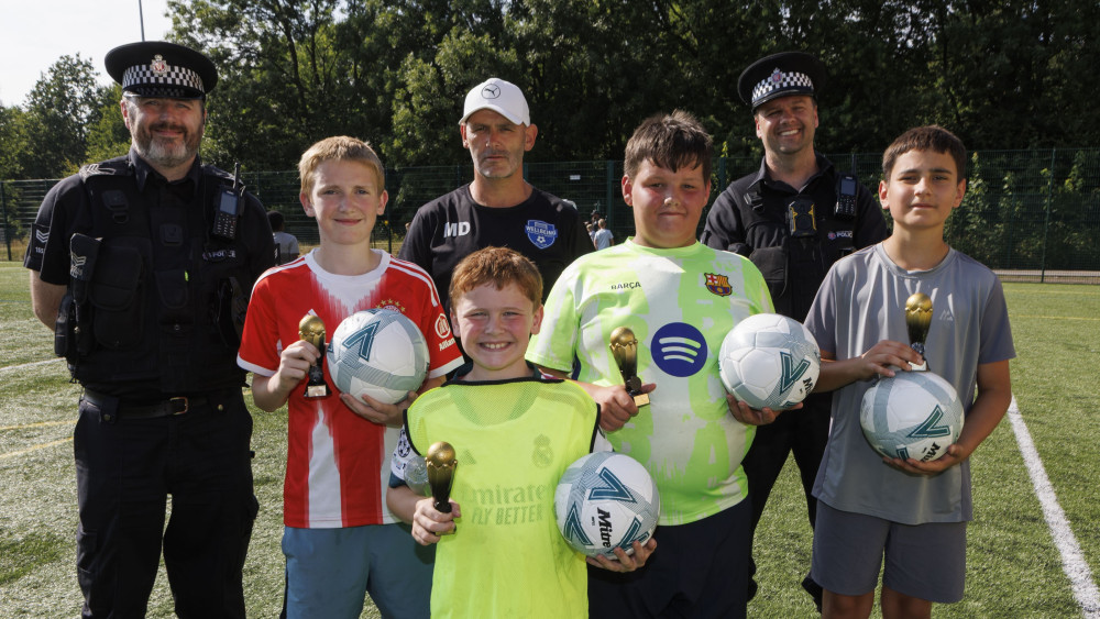 Police donated footballs and trophies to Brinnington's Wellbeing Football & Sports Club to help support local youngsters (Image - GMP)