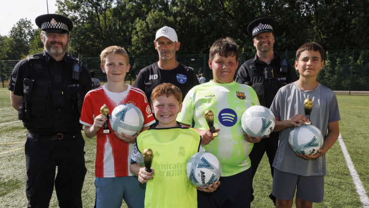 Police donated footballs and trophies to Brinnington's Wellbeing Football & Sports Club to help support local youngsters (Image - GMP)