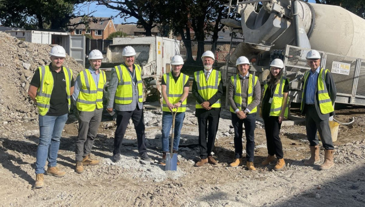 From left at the Lyndhurst Road site: Ben Darby, Auburn Group; Matt Bond, Auburn Group; Cllr Robert Willoughby; Cllr Tom Kelly; Cllr Ian Croom; Alex Ebsworth, Auburn Group; council officer Elizabeth Unwin and Iain Stevens, Director, Airey Miller construction consultancy
