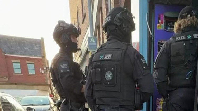  Armed officers descended on Queen Victoria Street in Macclesfield on Wednesday, September 23 (Credit: Supplied)